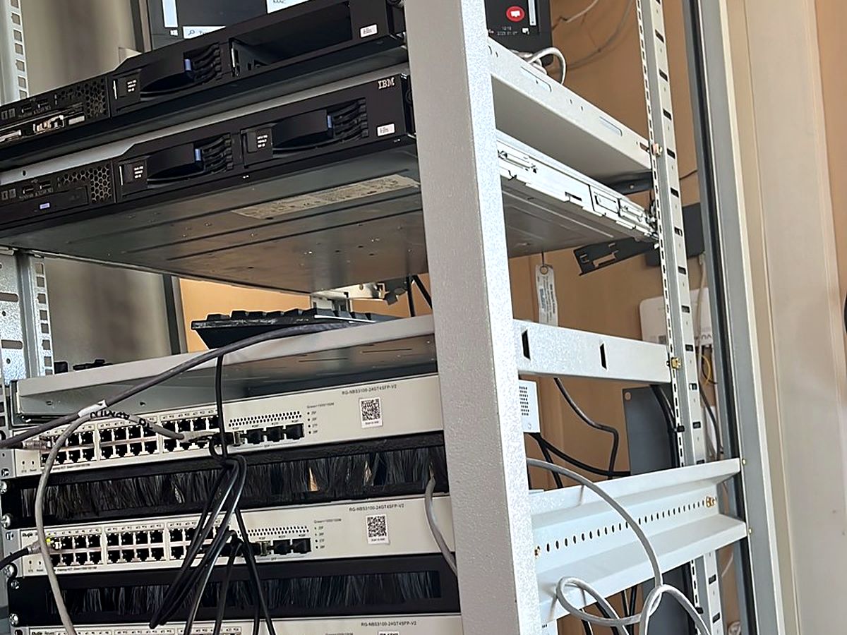 Open-frame rack holding servers, network switches and patch panels